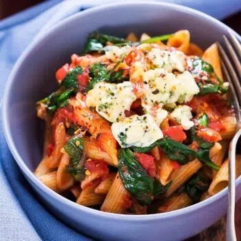 Quick And Easy Chicken Pasta With Spinach And Tomatoes In A Parmesan Cream Sauce