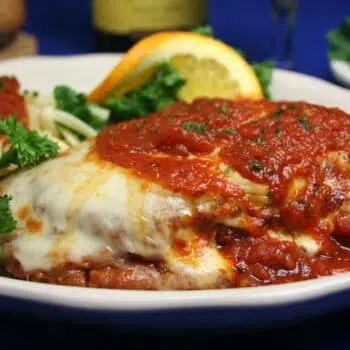 Healthy Chicken Parmesan With Hot Peppers Served With Spaghetti
