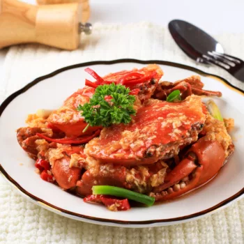 Authentic Singaporean Chilli Crab On A White Plate