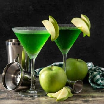 Easy Appletini (Sour Apple Martini) With Slices Of Apples Garnish
